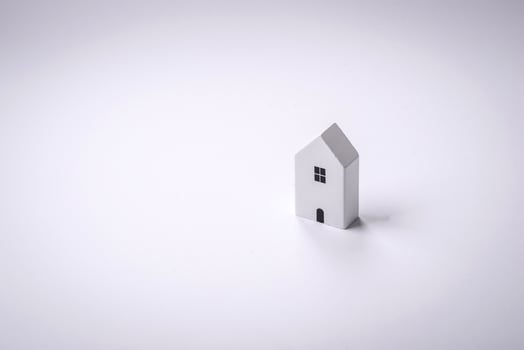 A small wooden house as an idea for investing in your own home and achieving the goal of buying real estate photo