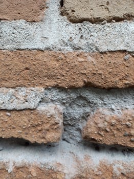 Background texture of old weathered brick wall photo
