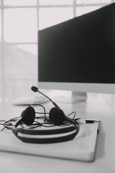 Communication support, call center and customer service help desk. VOIP headset on telephone keyboard. photo