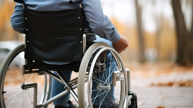 AI generated Close-up of senior man in wheelchair in park on blurred background photo