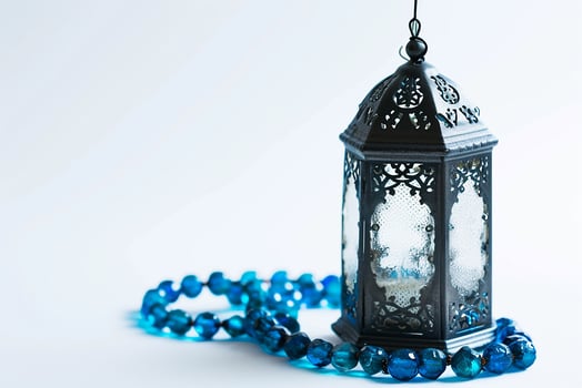 AI generated Ornamental Arabic lanterns. with tasbeeh on the table photo