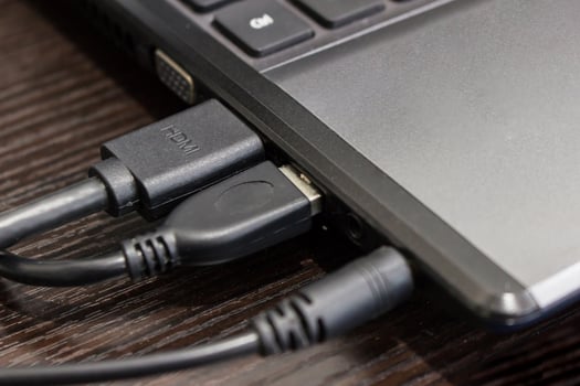 Close up port of computer for audio jack ,USB,hdmi cable connecting on the wood table joint concept photo