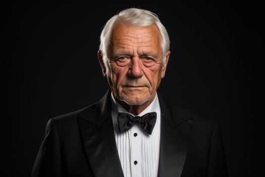AI generated Old man in tuxedo on black background, images of senior citizens photo