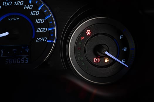 Close up the fuel indicator light on the dashboard of the car To add gasoline photo
