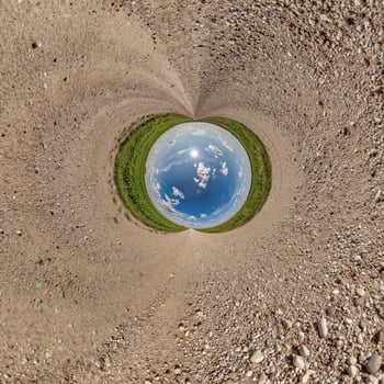 blue hole sphere little planet inside gravel sand round frame background photo