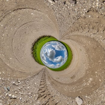 blue hole sphere little planet inside gravel sand round frame background photo