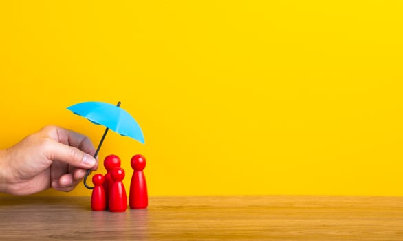 Hand holding umbrella and cover family. photo