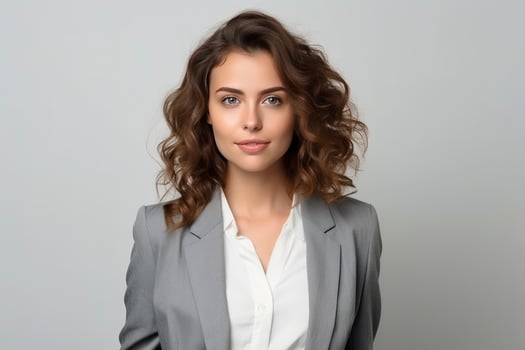 AI generated Portrait of wonderful young businesswoman wearing suit standing over gray background photo