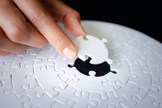Hand put the last piece of jigsaw puzzle to complete the mission, Business solutions, success and strategy concept, The solution includes completing the mission. photo