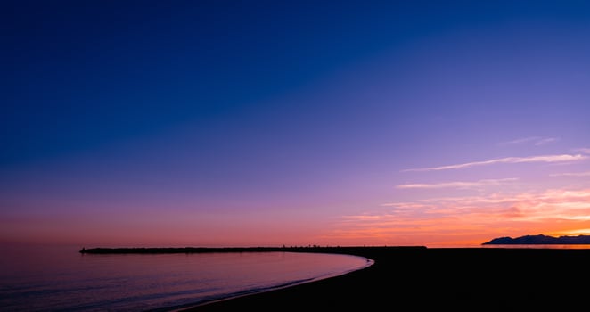 Sunset Sky,Cloud over Sea Beach in Evening on Spring,Landscape by Seaside with Colourful Sky in Orange,Pink,Purple,Blue.Horizon Summer Seascape Golden hour sky with twilight,Dusk sky background photo