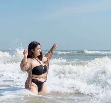 Portrait young asian woman fat chubby cute beautiful smile happy fun enjoy relax bikini swimwear body sexy front view sea beach white sand clean bluesky calm nature ocean wave water travel on holiday photo