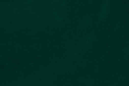 Green velvet fabric texture used as background. Emerald color panne fabric background of soft and smooth textile material. crushed velvet .luxury emerald tone for silk.. photo