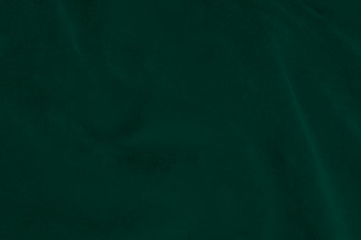 Green velvet fabric texture used as background. Emerald color panne fabric background of soft and smooth textile material. crushed velvet .luxury emerald tone for silk.. photo