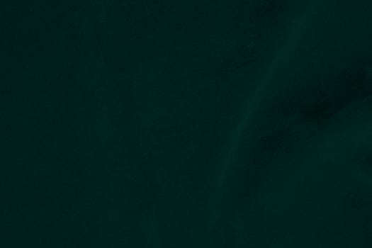 Green velvet fabric texture used as background. Emerald color panne fabric background of soft and smooth textile material. crushed velvet .luxury emerald tone for silk.. photo