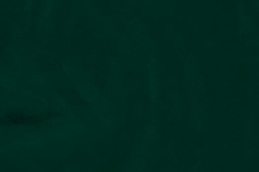 Green velvet fabric texture used as background. Emerald color panne fabric background of soft and smooth textile material. crushed velvet .luxury emerald tone for silk.. photo