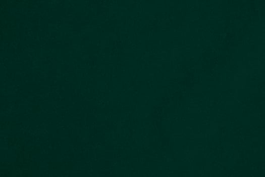 Green velvet fabric texture used as background. Emerald color panne fabric background of soft and smooth textile material. crushed velvet .luxury emerald tone for silk.. photo