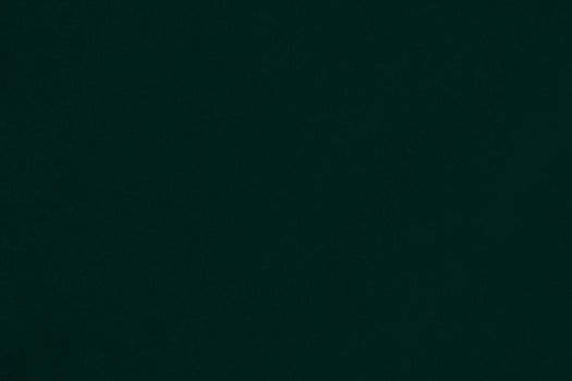 Green velvet fabric texture used as background. Emerald color panne fabric background of soft and smooth textile material. crushed velvet .luxury emerald tone for silk.. photo