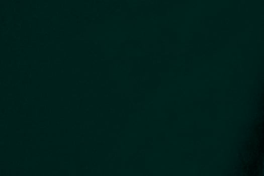Green velvet fabric texture used as background. Emerald color panne fabric background of soft and smooth textile material. crushed velvet .luxury emerald tone for silk.. photo