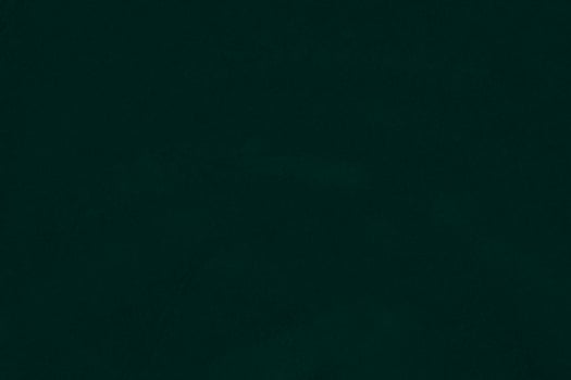 Green velvet fabric texture used as background. Emerald color panne fabric background of soft and smooth textile material. crushed velvet .luxury emerald tone for silk.. photo