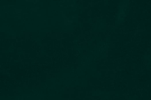 Green velvet fabric texture used as background. Emerald color panne fabric background of soft and smooth textile material. crushed velvet .luxury emerald tone for silk.. photo