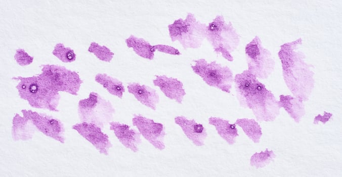 Drawn dots with acrylic purple paint on a white  background photo