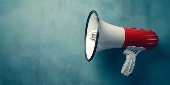 AI generated Megaphone or hand speaker isolated on blue background with copy space photo