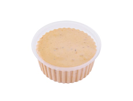 A bowl of mayonnaise on a white background photo