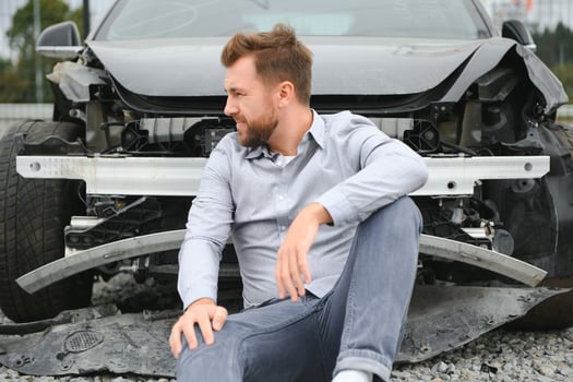 Car accident. Man after car accident. Man regrets damage caused during car wreck photo
