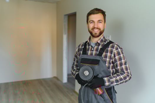 Portrait of a construction worker or repairman in the house photo