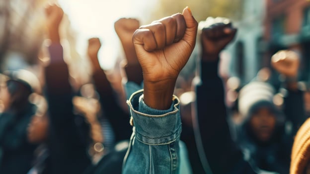 AI generated Multi-ethnic people raise their fists up in the air in a protest. photo