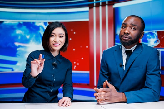 News presenters team on morning show addressing daily breaking news and providing information for exclusive content. Diverse newscasters team meeting in newsroom to debate topics. photo
