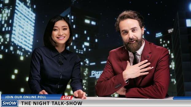 Night talk show hosts on live television presenting news about famous celebrities, working on media entertainment segment. Diverse team of newscasters covering worldwide topics. photo