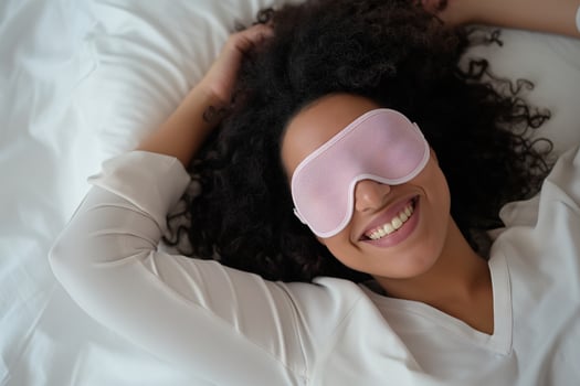 AI generated Young african american woman with sleep mask in bed, top view. before bedtime photo