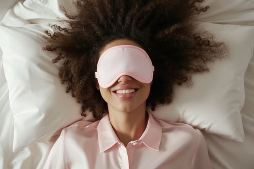 AI generated Young african american woman with sleep mask in bed, top view. before bedtime photo