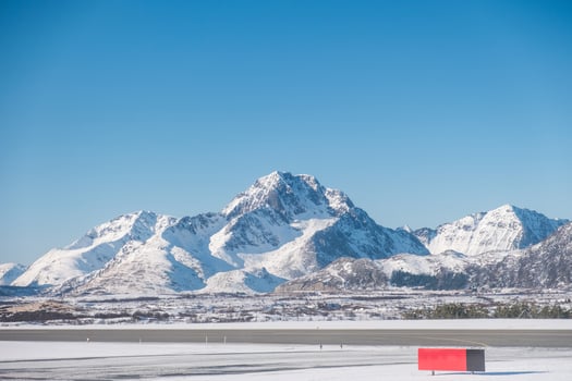 Landscape of snowy mountain range on winter at the airport photo