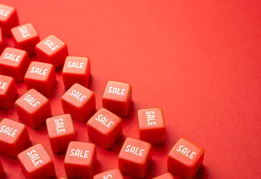 Sale in red color blocks. Cashback and discounts. Marketing and retail. Favorable offers, customer loyalty program. Savings on shopping. Holiday shopping season. Save money on purchases. photo