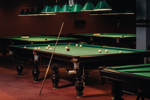Billiard table with green surface and balls in the billiard club.Pool Game photo