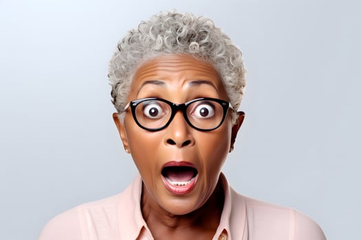 AI generated surprised senior African American woman, head and shoulders portrait on white background. Neural network generated image photo