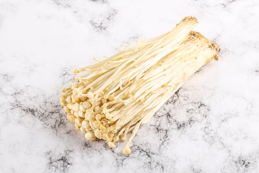 Tasty raw enoki mushroom heap photo
