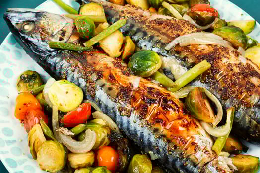Grilled mackerel fish with vegetables. photo