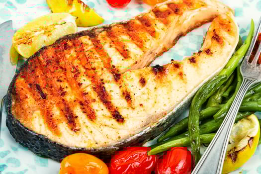 Plate of grilled salmon steak. photo