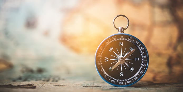 magnetic compass is placed on the map. Travel Ideas or Success photo