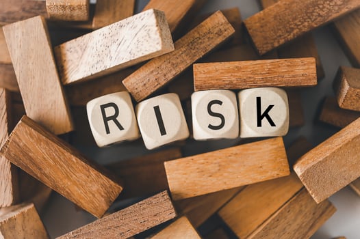 wooden block with the word RISK Concept risk photo