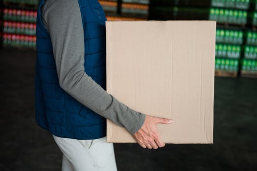 Cardboard box shipping concept Man is holding a brown parcel photo