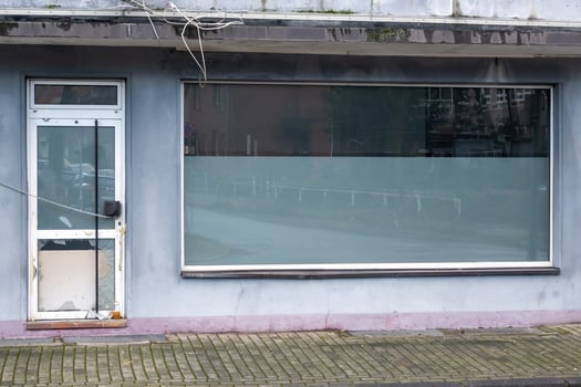 abandoned derelict store with shop window photo