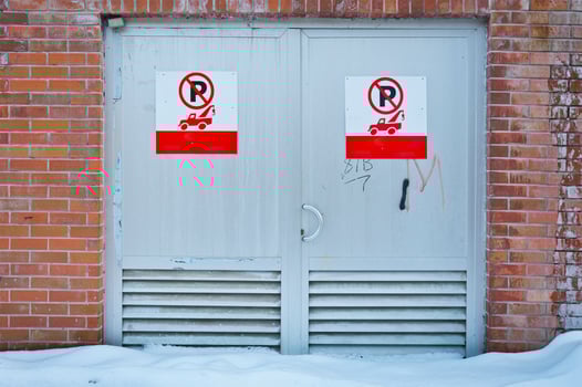 Snow covered alley red metal door entrance photo