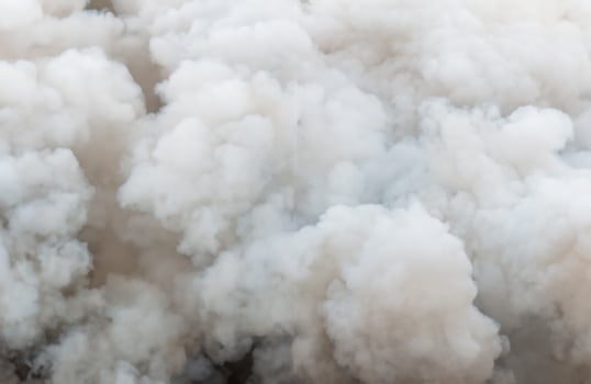 Close up swirling white smoke background,Billowing Black Smoke from ignition midden. photo