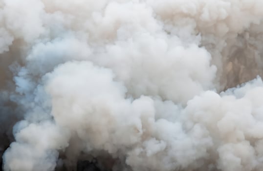 Close up swirling white smoke background,Billowing Black Smoke from ignition midden. photo