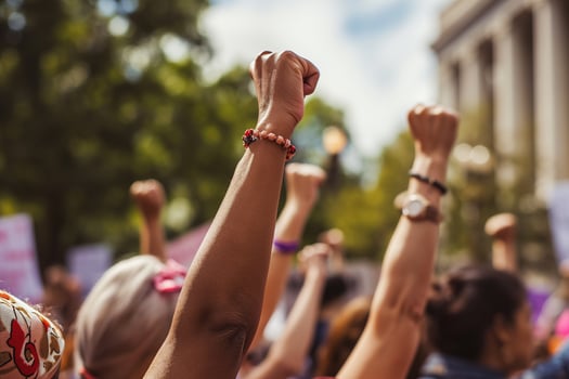 AI generated Close-up of a group of women's hands raising their fists in the air, girl power concept photo