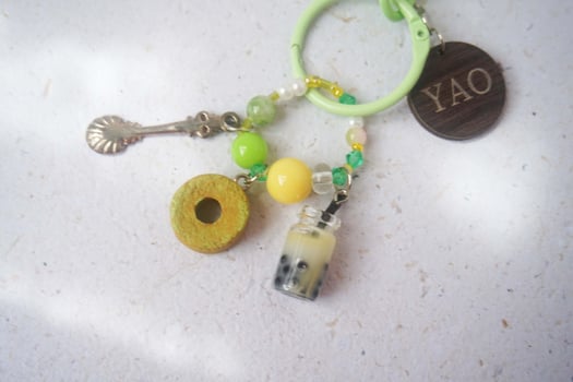 old vintage key chain with a lot of cute accessories made from miniature clay and resin photo